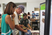Andrea Kawabata showing participants green coffee